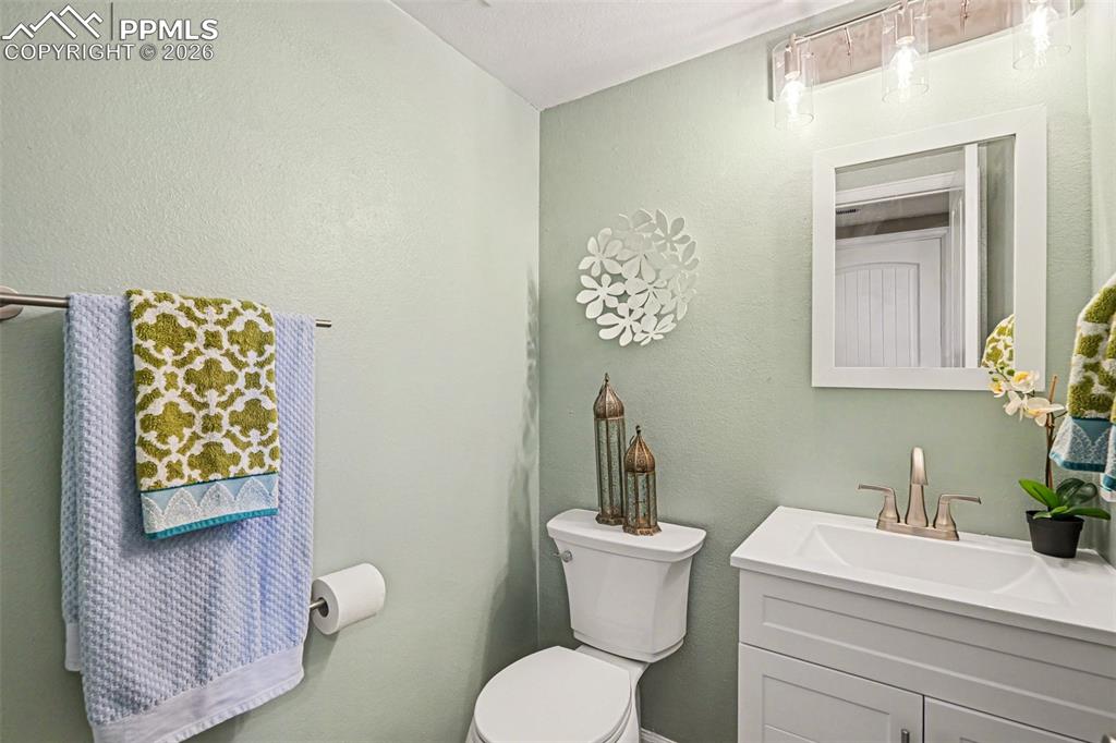 The hall bathroom has been beautifully updated with a new vanity, toilet, LVP flooring, and modern fixtures.