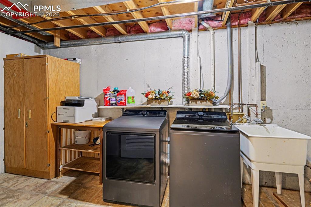 Laundry room with a convenient sink and extra storage space.