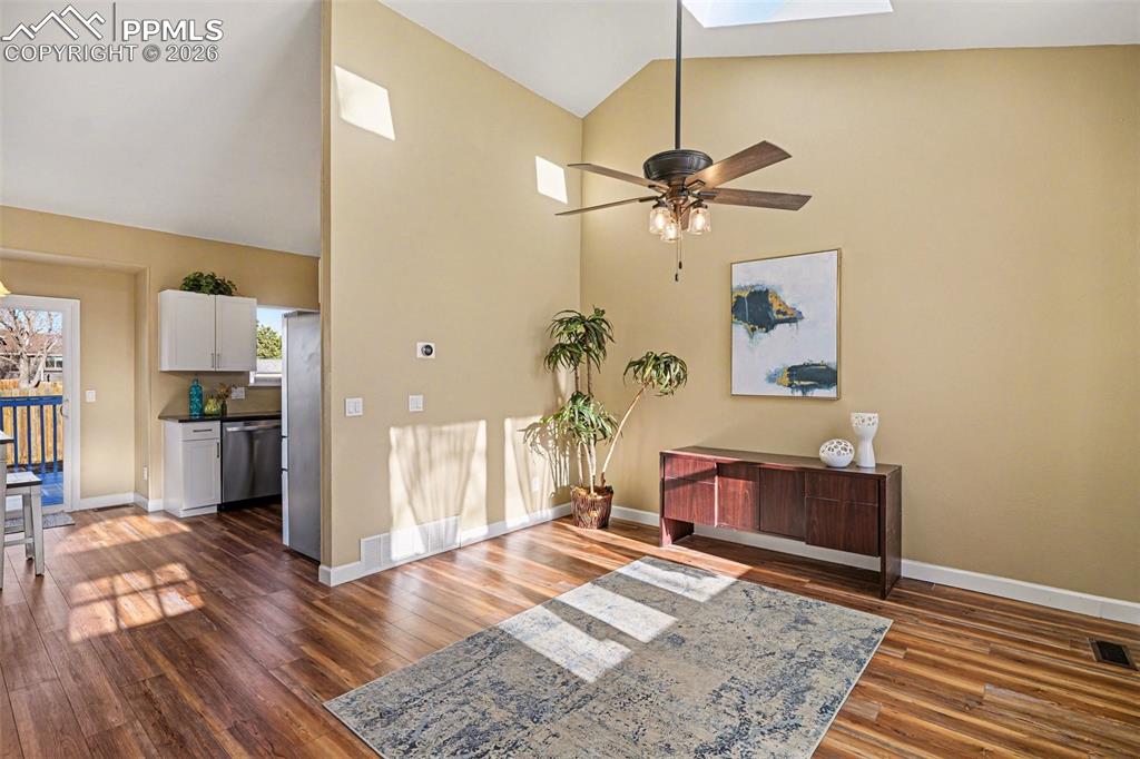 Two skylights in the living room fill the home with natural light. Luxury vinyl flooring on the main level
