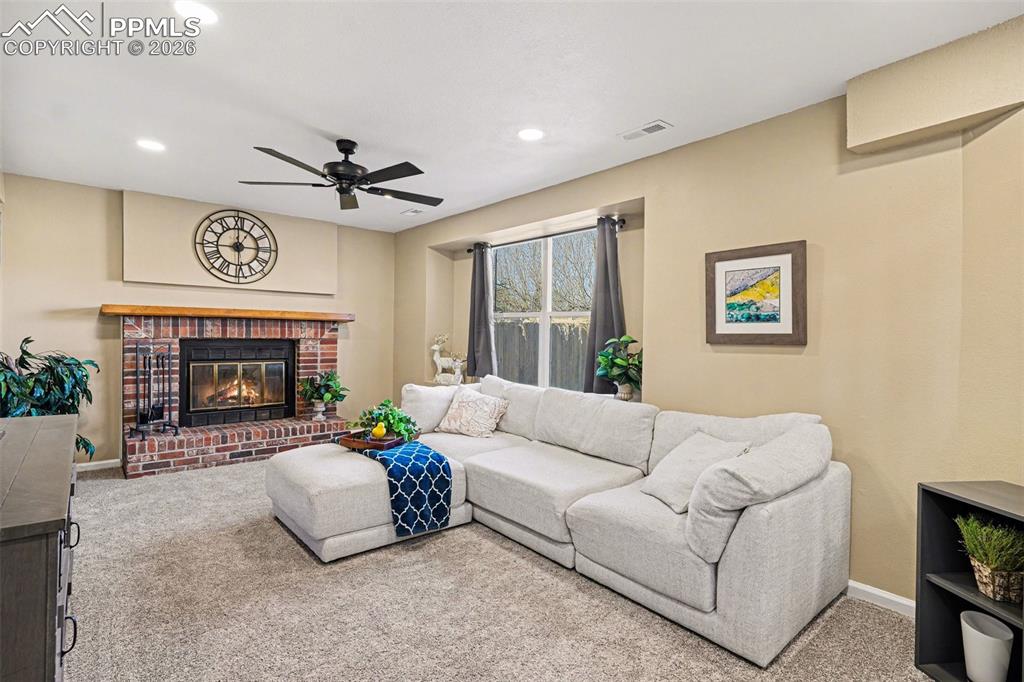 The family room is a true highlight with gorgeous can lighting and a charming brick wood-burning fireplace—perfect for cozy evenings.