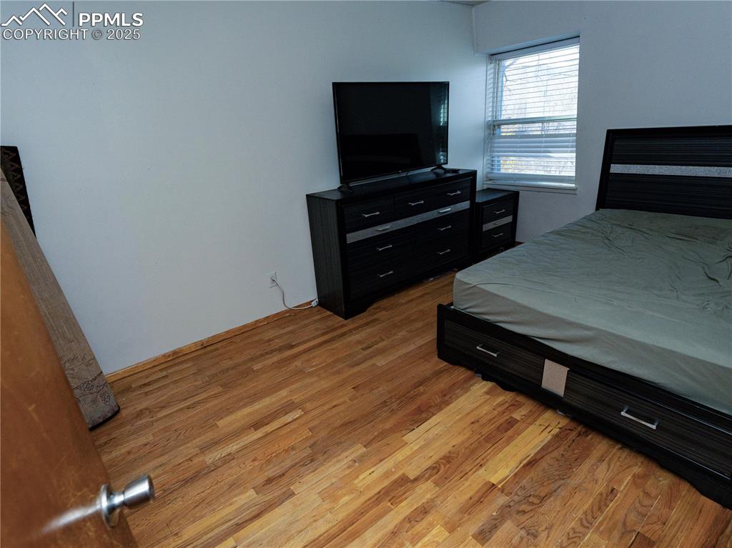 Bedroom with light wood-type flooring