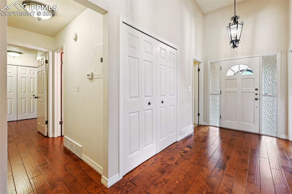 Wide foyer for welcoming guests, complete with a large coat closet.