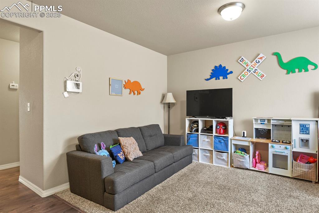 Living room featuring baseboards and wood finished floors