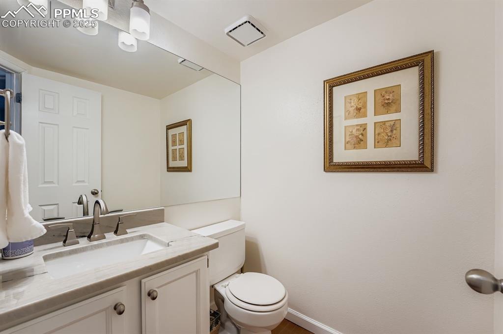 Half bath with vanity and toilet