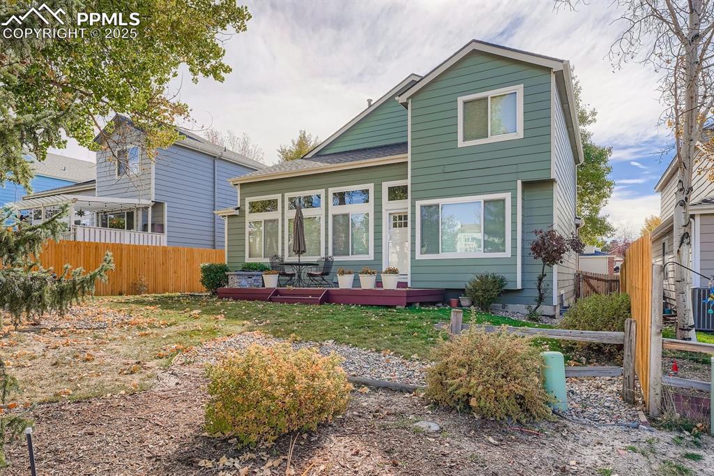 Rear view of house with a deck