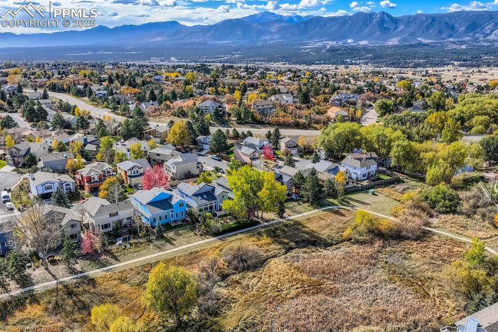 Aerial view of residential area featuring a mountainous background