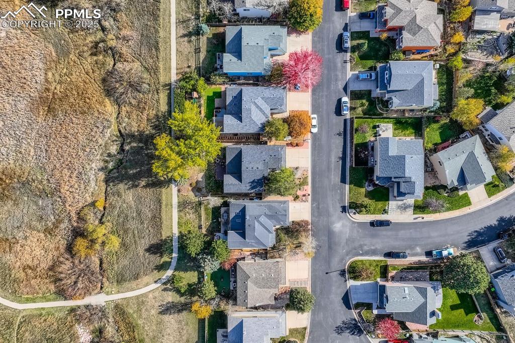 Aerial view of property's location featuring nearby suburban area