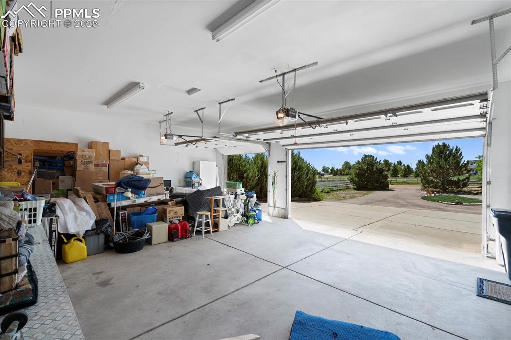 Garage featuring a garage door opener