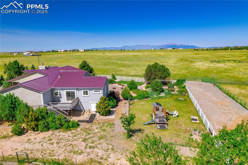 Overview of rural landscape featuring a mountain backdrop