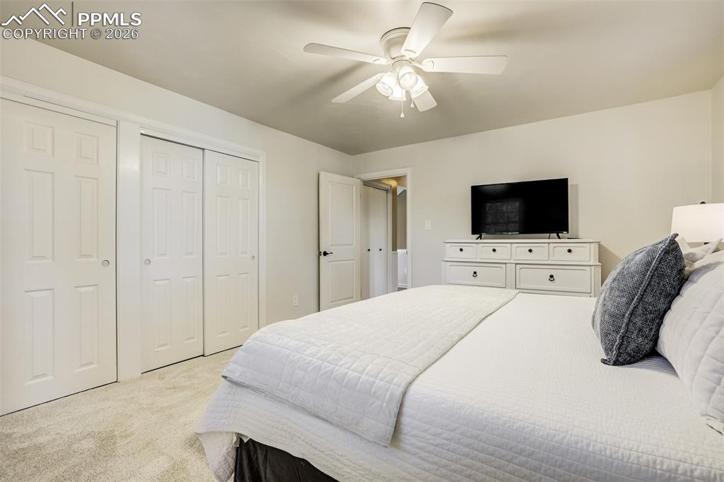 Main level primary bedroom with multiple closets