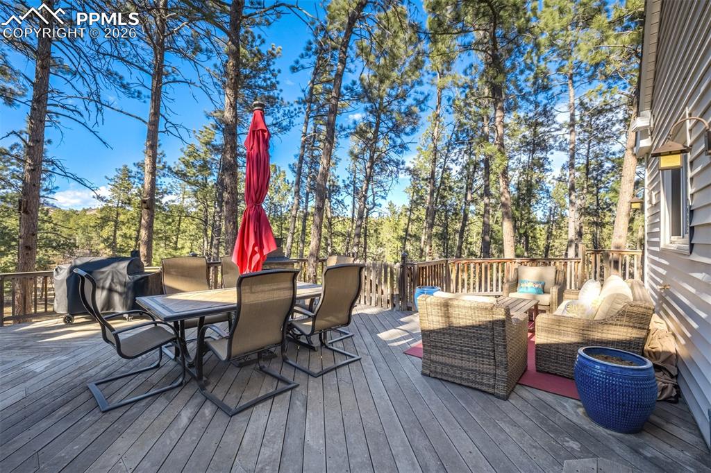 Brazilian hardwood deck with outdoor dining area, a Jacuzzi hot tub