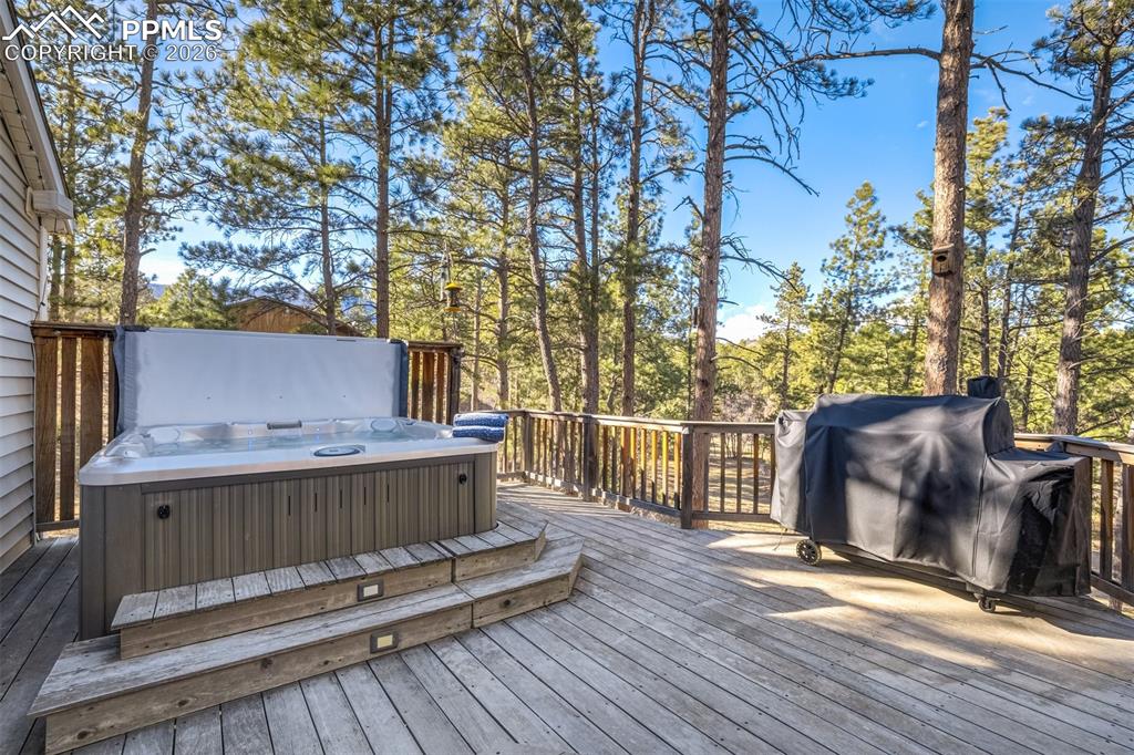 Brazilian hardwood deck with outdoor dining area, a Jacuzzi hot tub