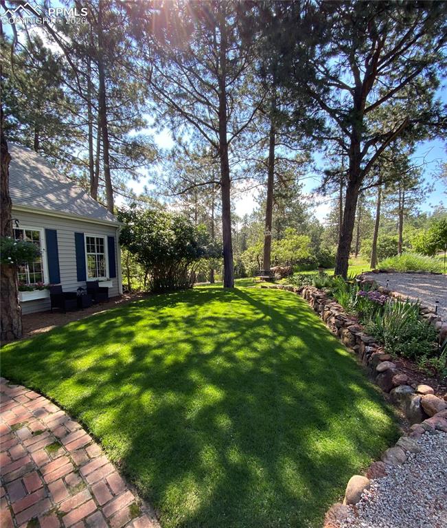 Pride in ownership at every turn. Beautifully manicured lawn, perennial gardens, raised vegetable gardens.