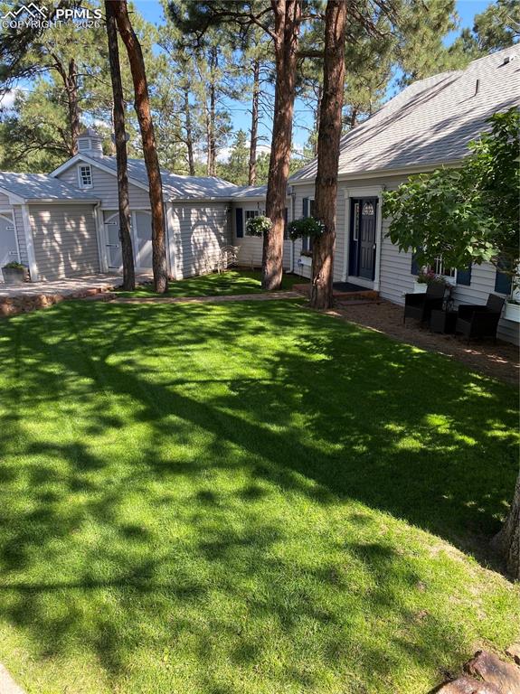 Beautifully maintained lawn with perennial gardens.