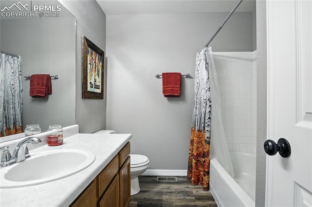 Bathroom featuring vanity and bathing tub / shower combination