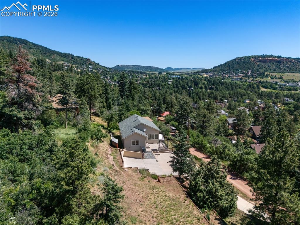 View of subject property featuring a mountainous background