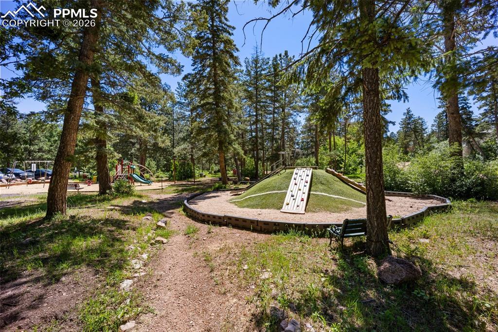 View of property's community with view of scattered trees