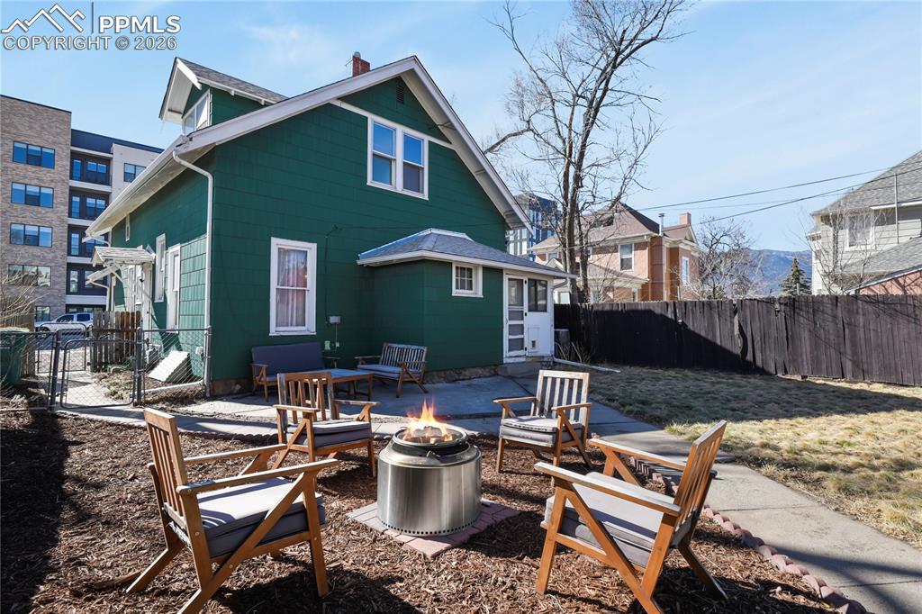 Spacious backyard with fire-pit area
