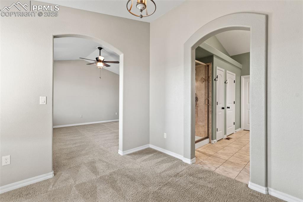 Primary bedroom with sitting area and attached bath