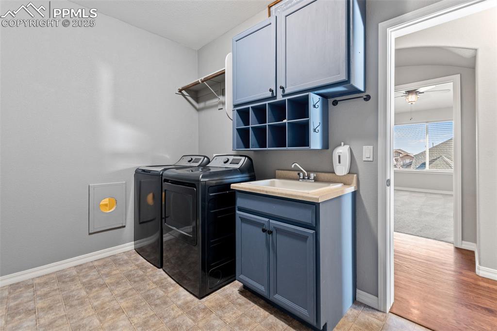 Washroom with cabinet space and independent washer and dryer