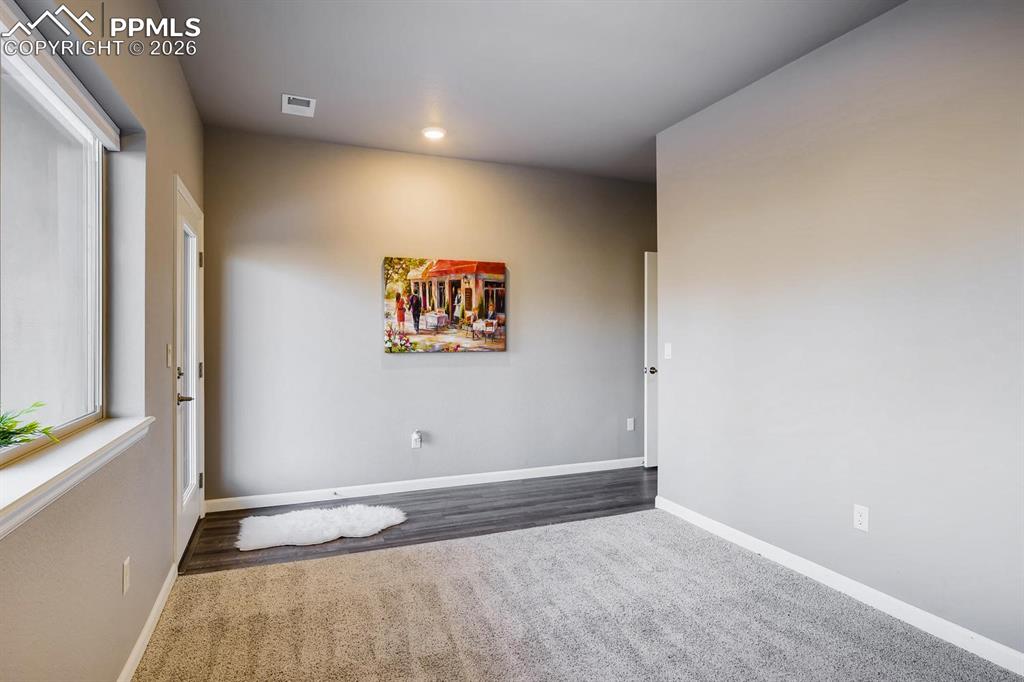 Main floor bedroom with en-suite bath and private walkout to patio