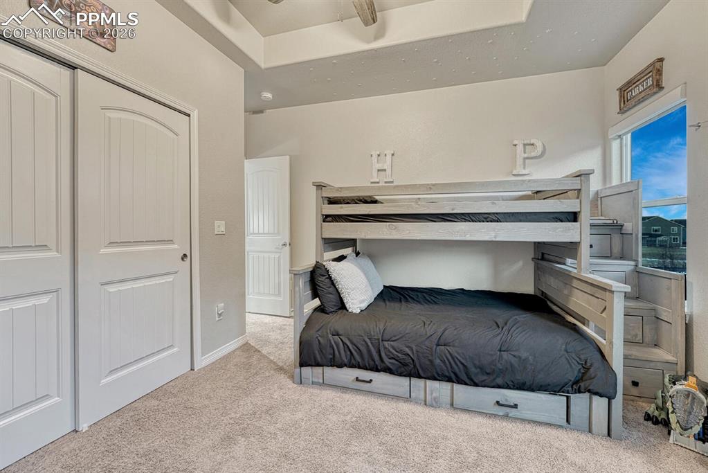 Bedroom featuring carpet floors and a closet