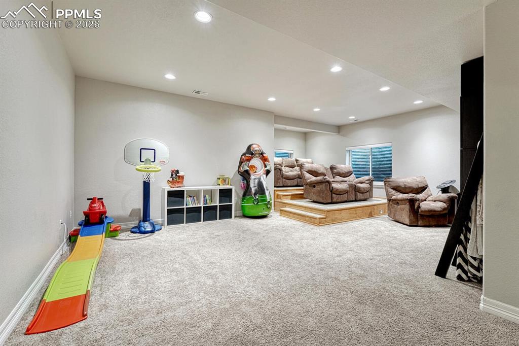 Game room featuring carpet and recessed lighting