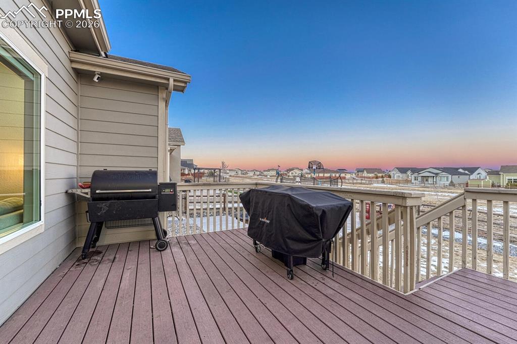 Deck with grilling area and a residential view