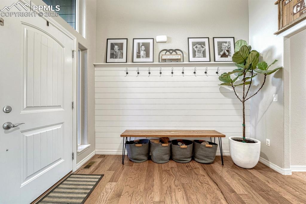 Mudroom with wood finished floors