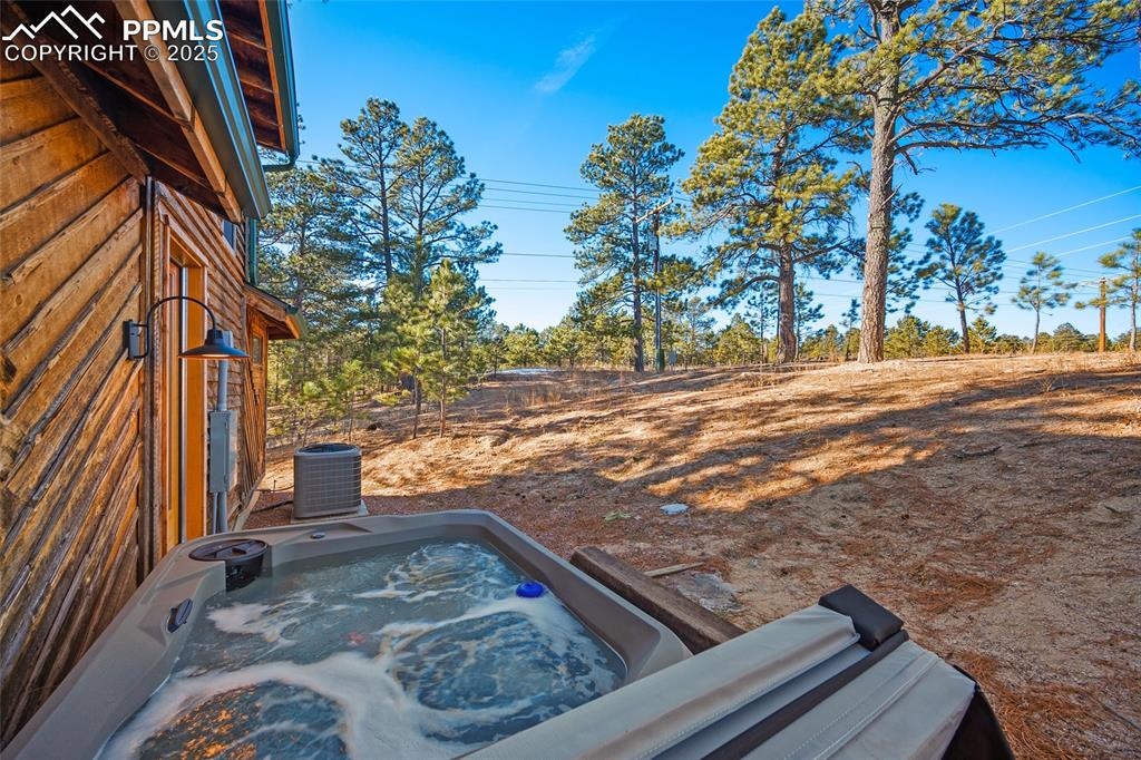 Hot tub in the forested backyard