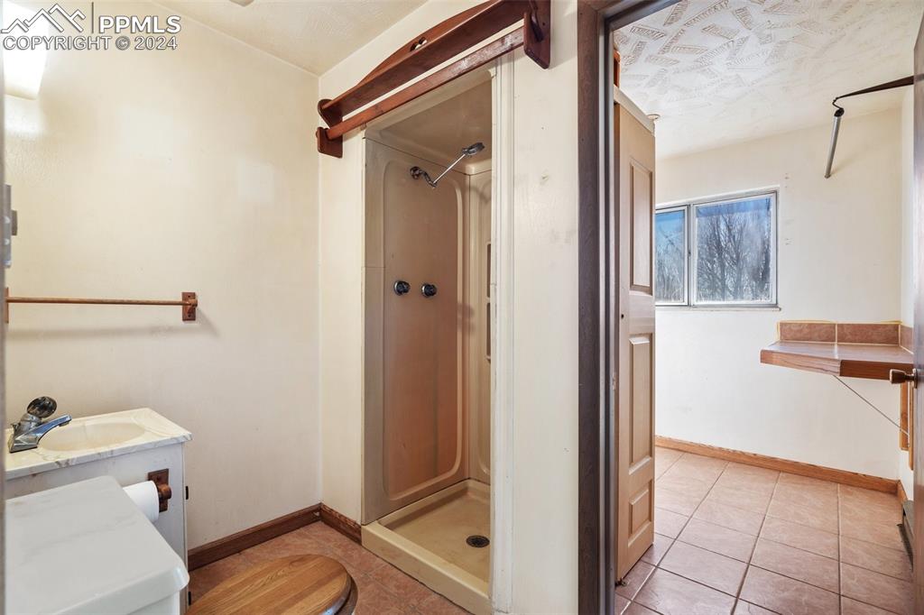 3/4 Bathroom and back laundry area 