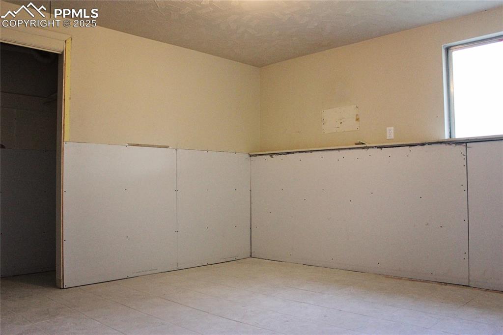 Unfinished bedroom in basement (sheetrock recently added)