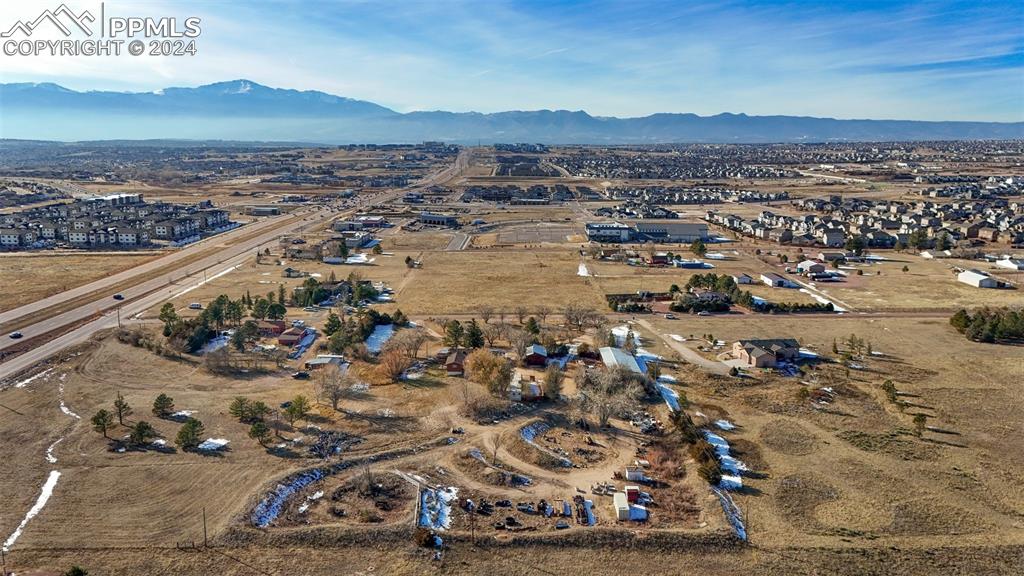 Aerial view featuring a mountain view - Woodmen Road to the south (left)