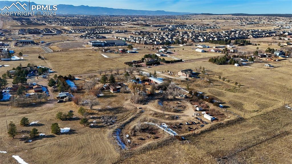 Aerial view showcasing the property - equipment storage areas at the back of the property