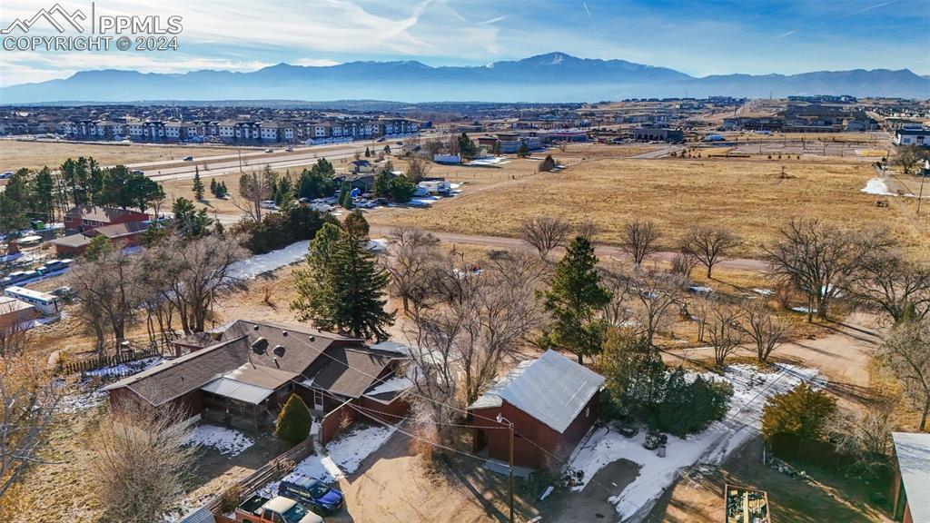 Bird's eye view looking SW - showcasing the house and one of the outbuildings
