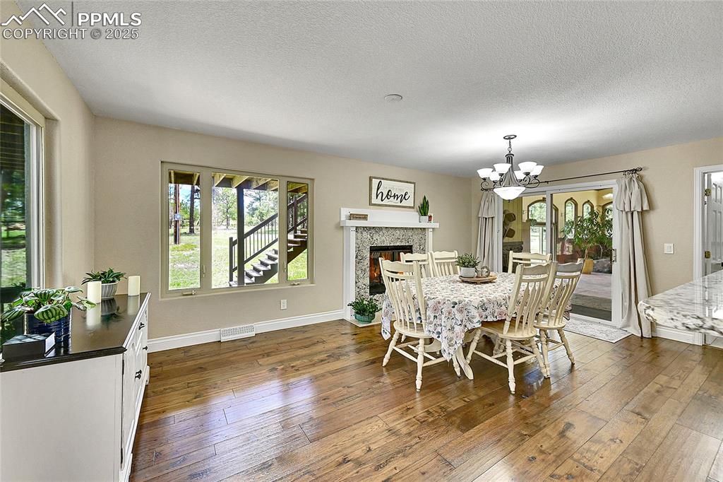 Formal Dining space featuring fireplace and walk out to back deck