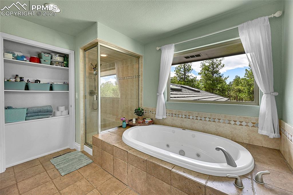 Featuring a jetted tub and steam shower