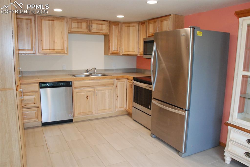 Also featured in the Kitchen are stainless steel appliances.  Refrigerator included!