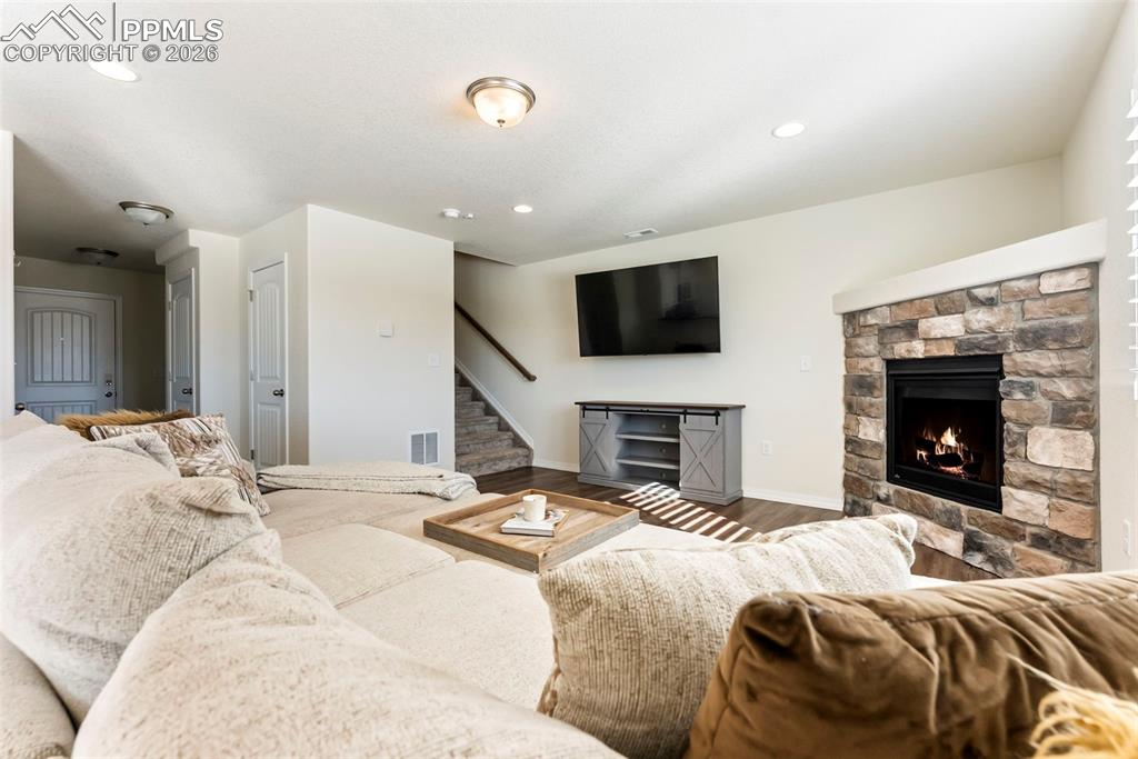 Cozy living room with inviting corner fireplace