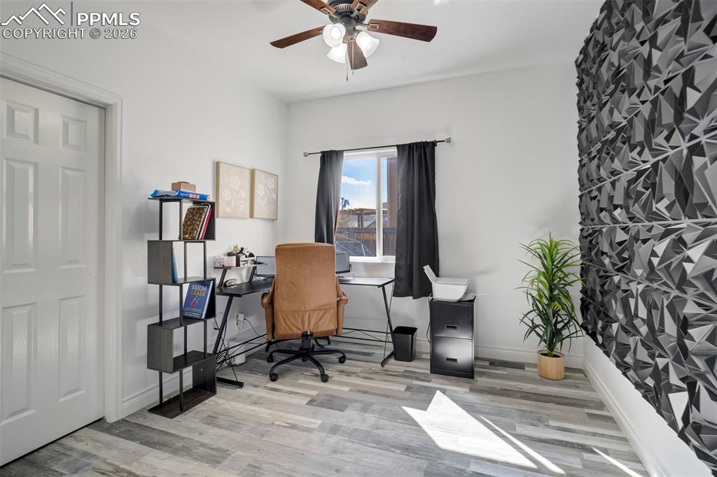 Main level bedroom currently used as an office space. 