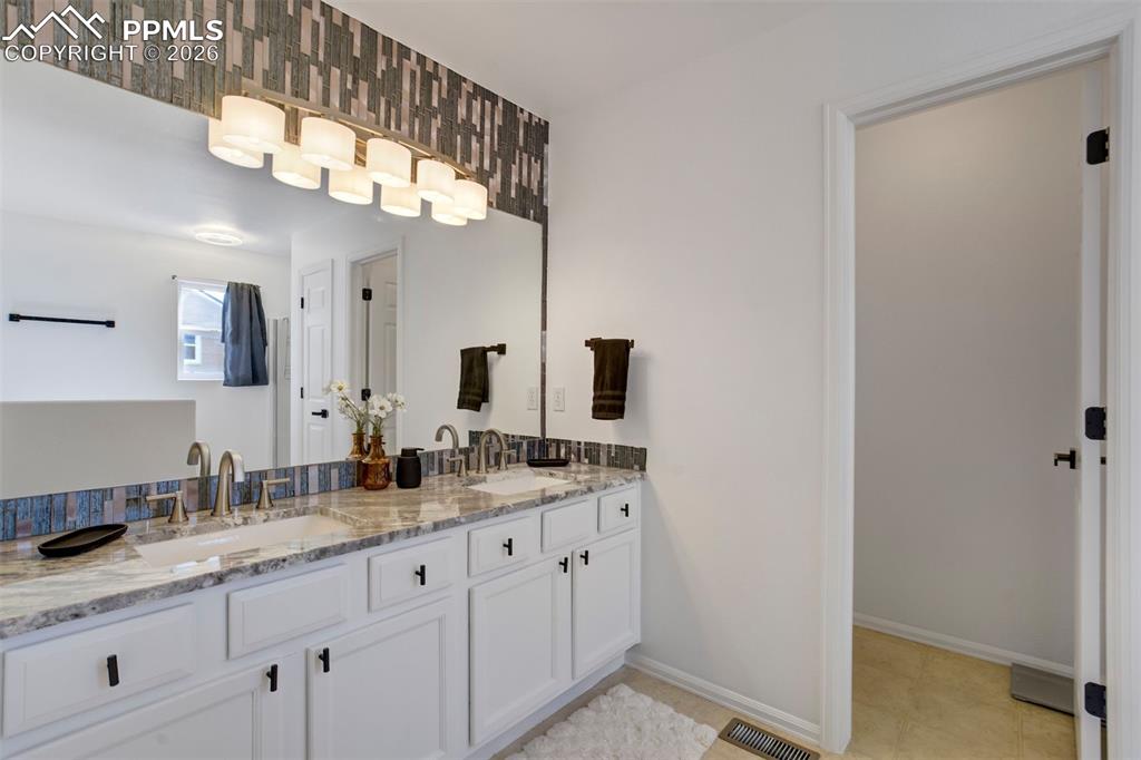 Slab granite counters with custom backsplash. 
