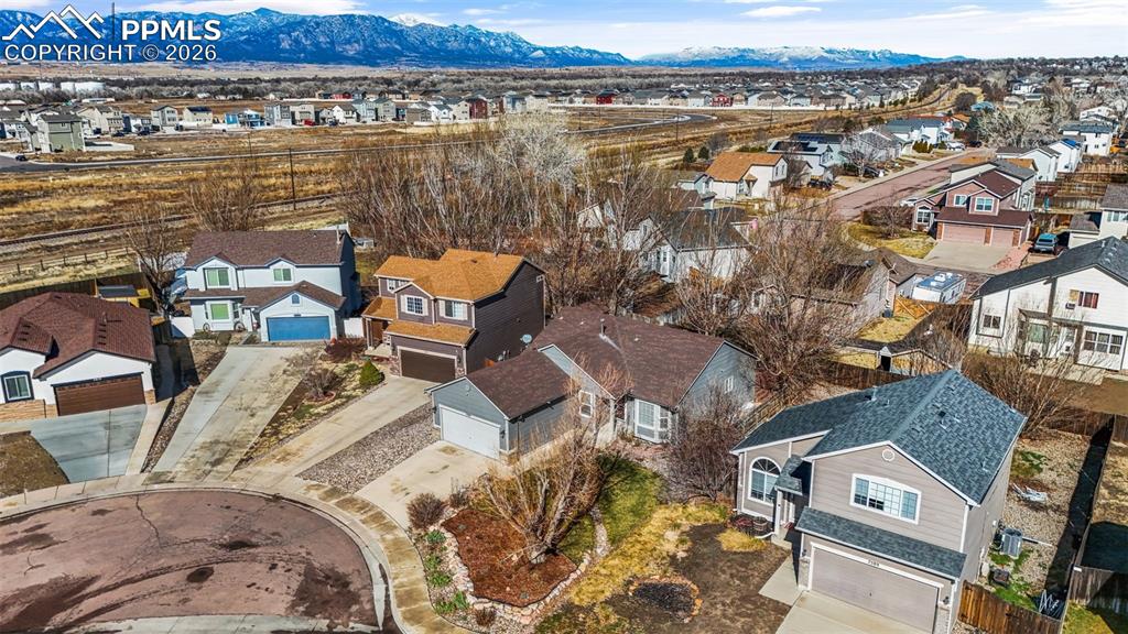 Aerial view of residential area with mountains