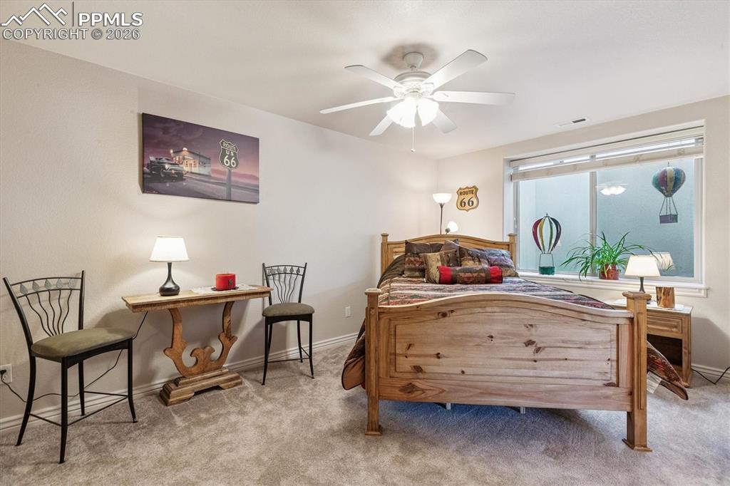 Bedroom with carpet flooring and ceiling fan