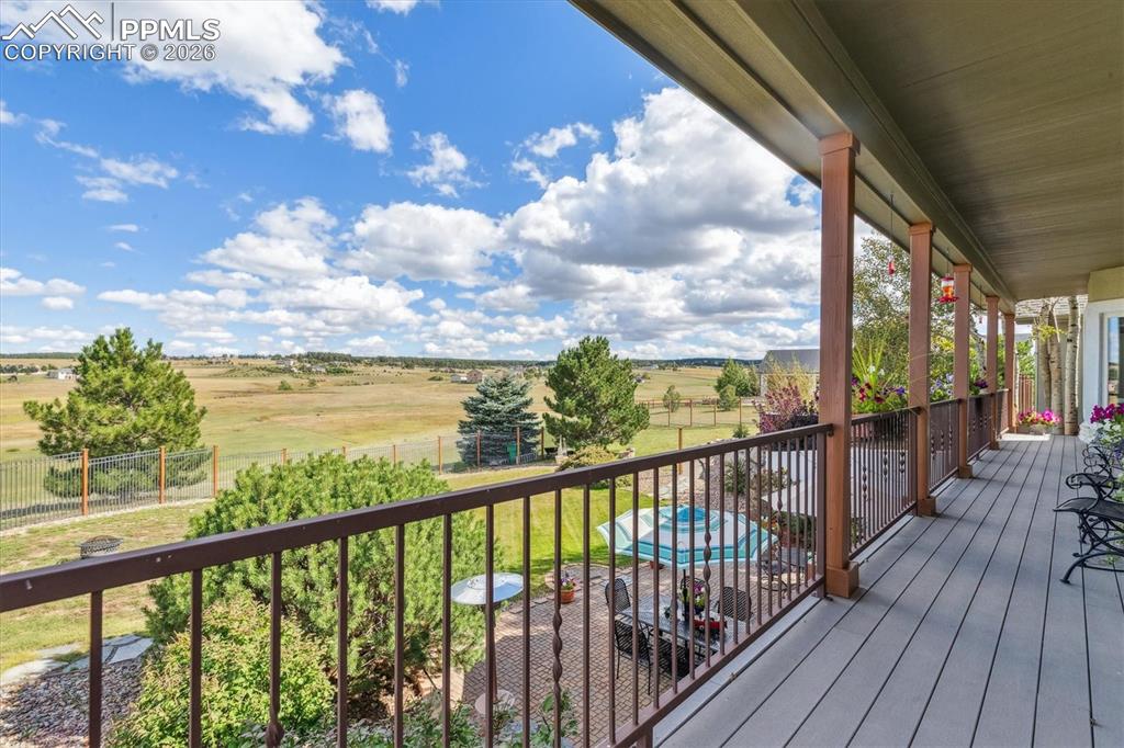 Wooden deck featuring a view of countryside