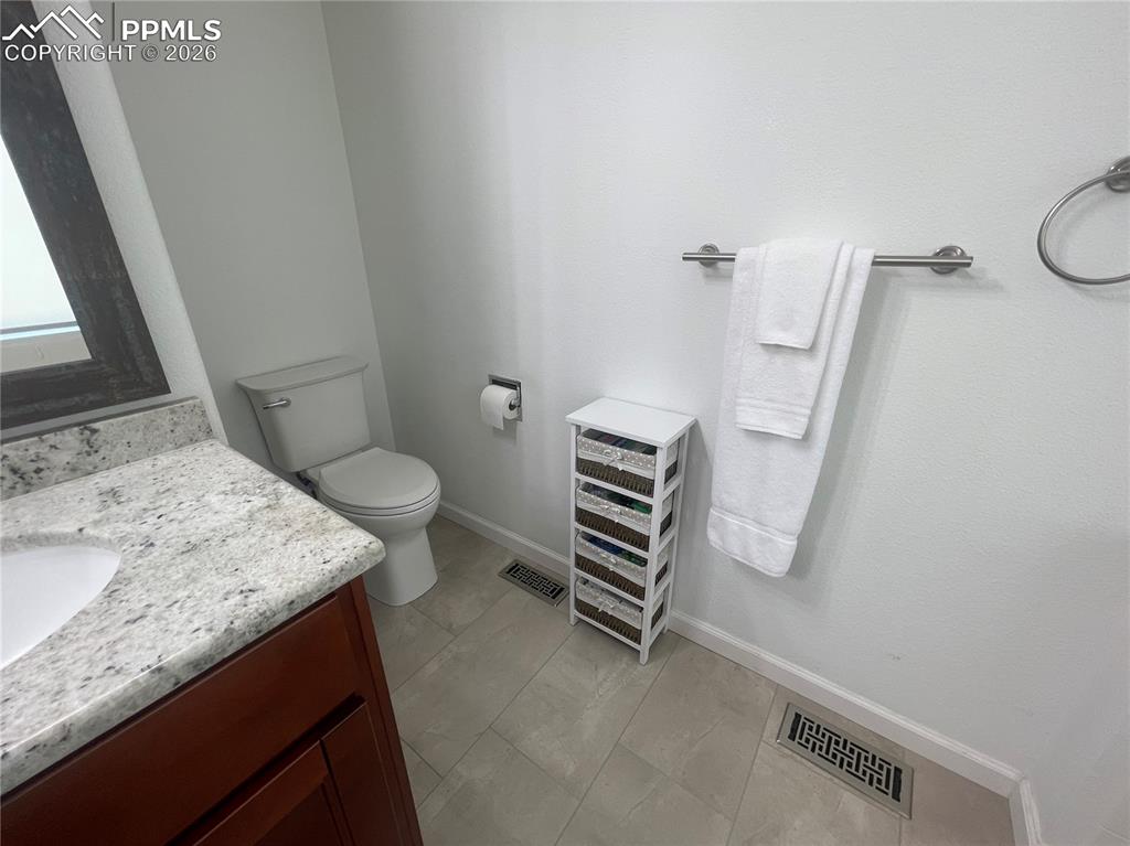 Bathroom with vanity and light tile patterned floors