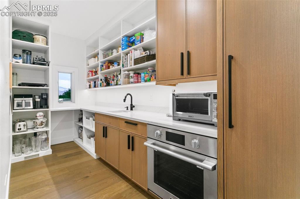 Walk behind 'working' pantry includes a sink, freezer, full size Oven and even views from the window!