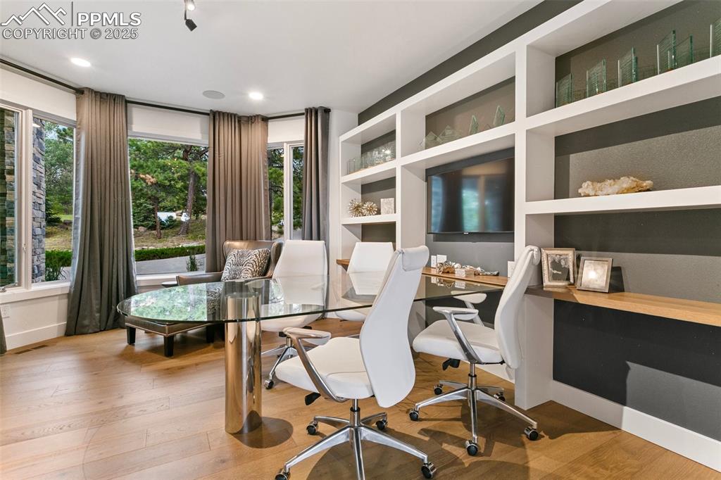 Built-in Display shelves are balanced by a large storage closet (not pictured) to accomodate filing cabinets and storage.