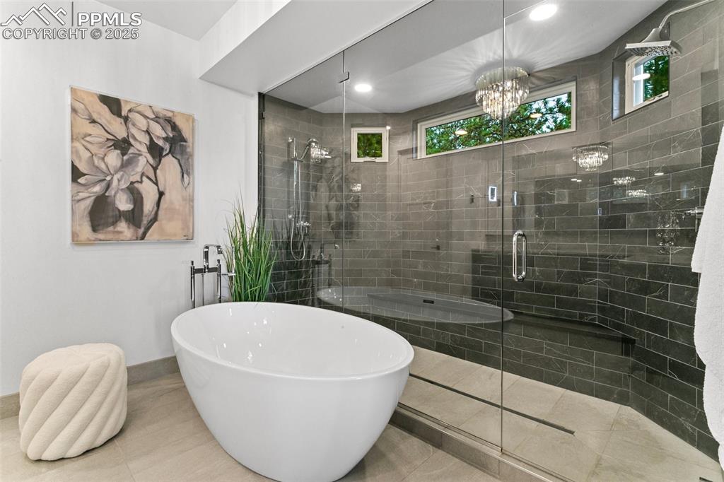 Your own spa at home! Enjoy heated floors and more views from the soaking tub or relax in the dual-headed massive shower!