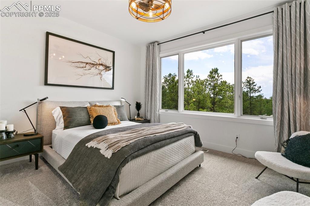 This bedroom is located on the upper floor and has its own private vanity, a walk-in closet and shares the tub/shower and toilet in a "jack and jill" layout. 