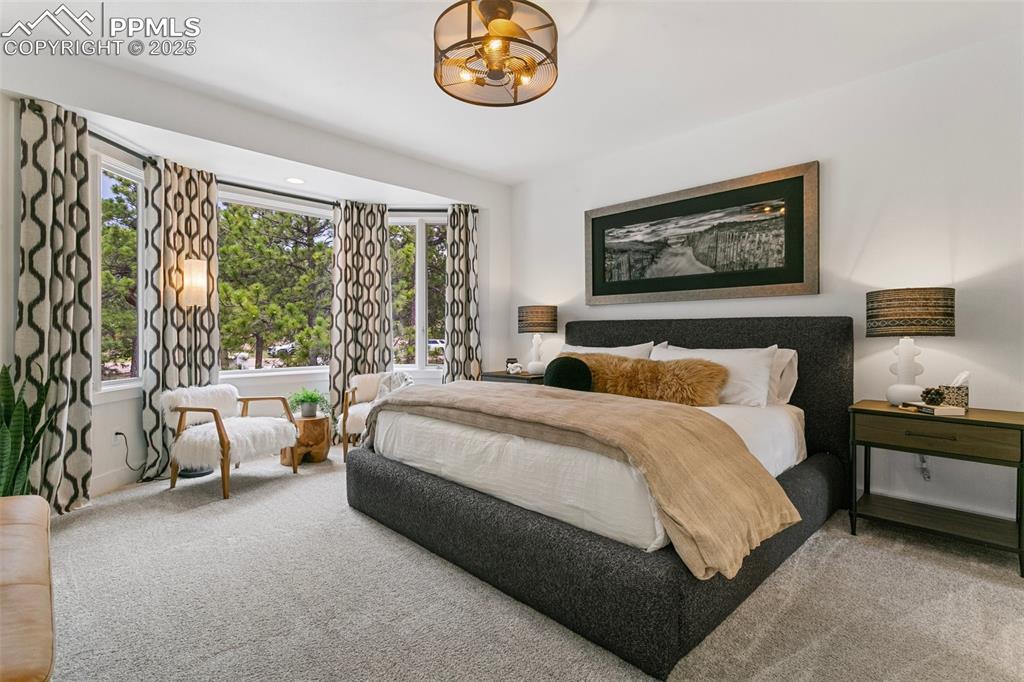 Huge Bedroom with bay window provides for a peaceful seating area with tons of natural light.